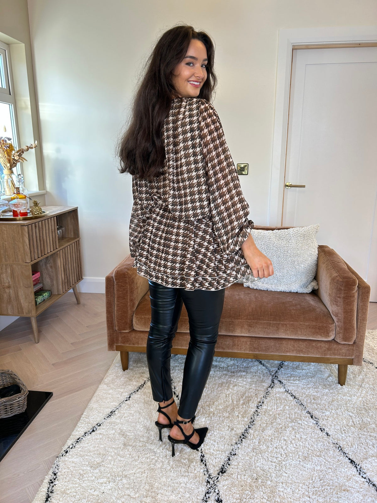 Brown and cream checked tunic with long balloon sleeves, shown from the back.